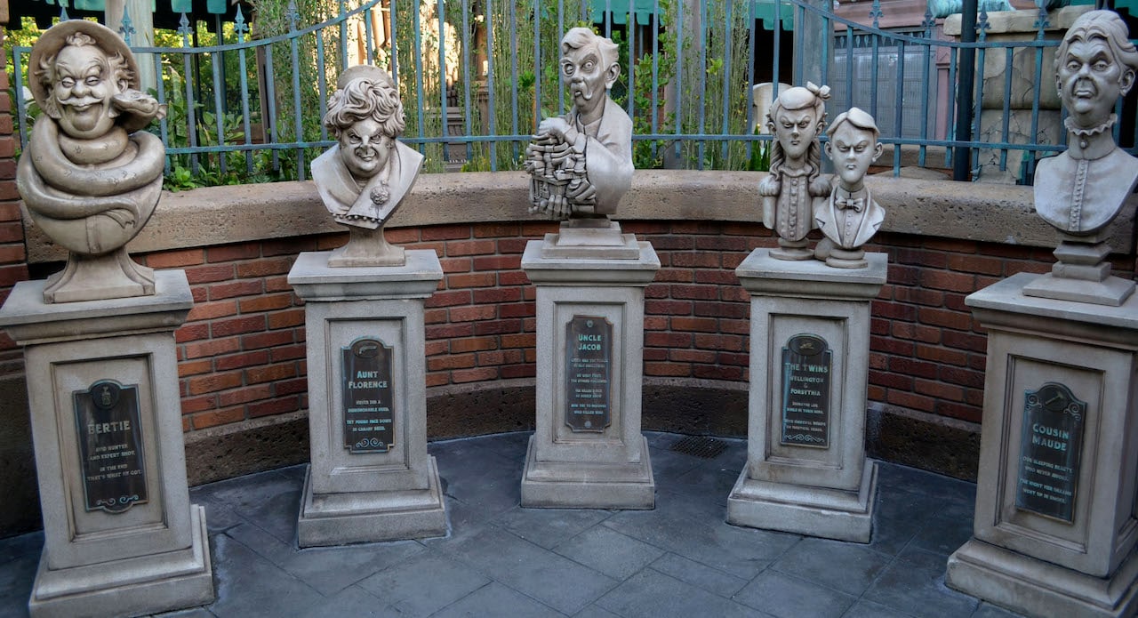 Family of busts in the cemetery at the Haunted Mansion
