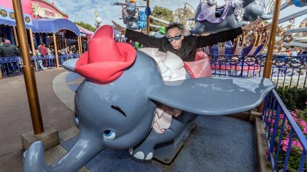 Director Tim Burton rides Dumbo at Disneyland Park