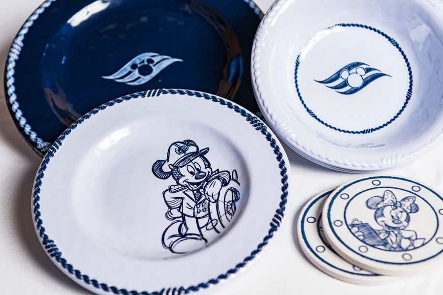 Plates and coasters from the Animator’s Palate merchandise collection aboard Disney Cruise Line ships
