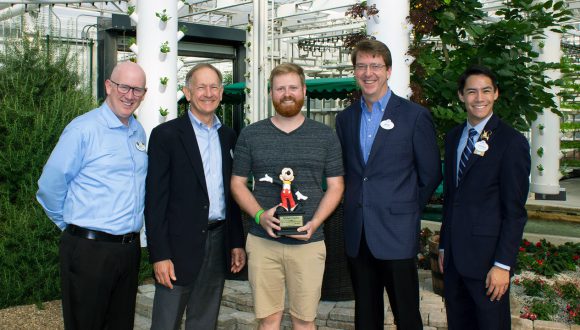 Michael Ogden with Walt Disney World Resort cast members at Epcot