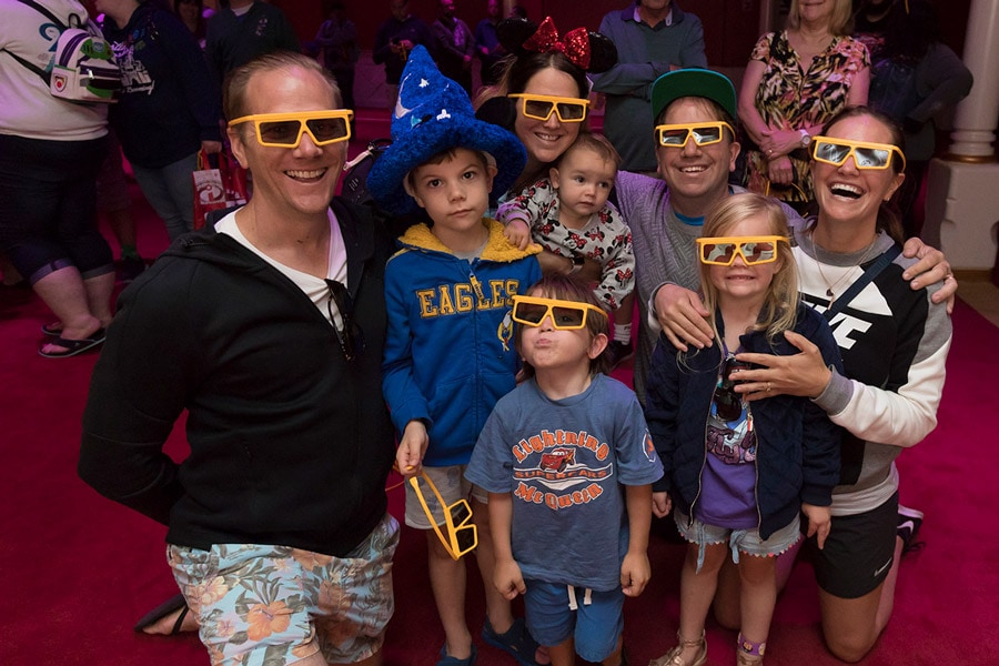 Guests in 3D glasses pose at “Mickey’s PhilharMagic” at Disney California Adventure park