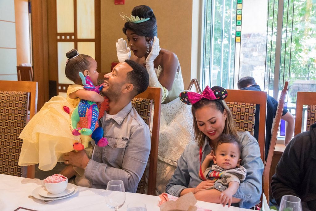John Legend, Chrissy Teigen, their daughter Luna and son Miles share a magical moment with Princess Tiana during the new Disney Princess Breakfast Adventures at Disney’s Grand Californian Hotel