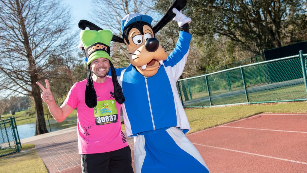 Guest with Goofy at a runDisney event