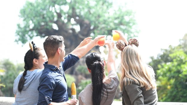 Friends raise glasses at Disney's Animal Kingdom