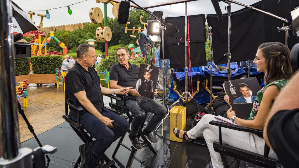 Tom Hanks (left) and Tim Allen (center), stars of Disney and Pixar’s “Toy Story 4,” with Paula Faris from GMA (right) inside Toy Story Land at Disney’s Hollywood Studios
