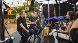 Tom Hanks (left) and Tim Allen (center), stars of Disney and Pixar’s “Toy Story 4,” with Paula Faris from GMA (right) inside Toy Story Land at Disney’s Hollywood Studios