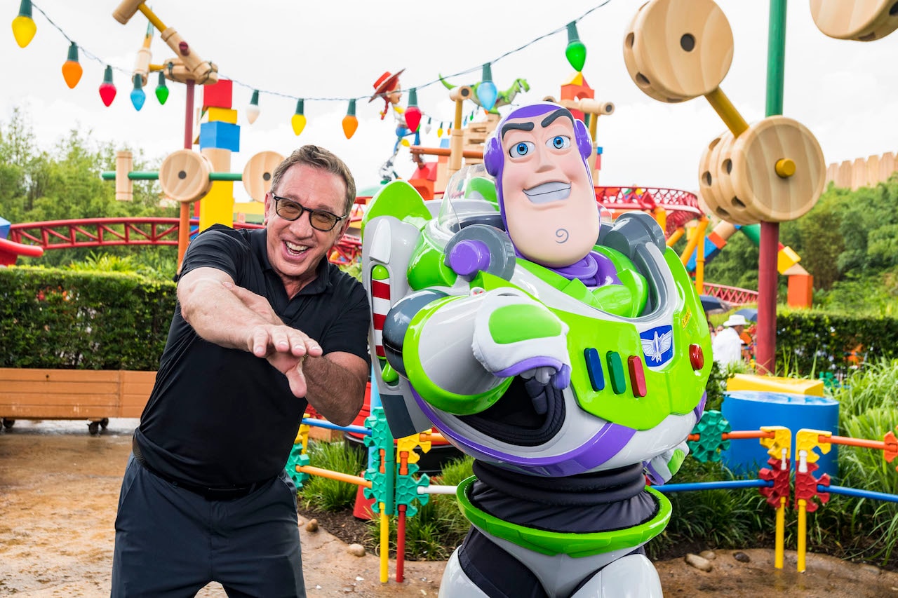Tim Allen (left) with Buzz Lightyear (right) inside Toy Story Land at Disney’s Hollywood Studios