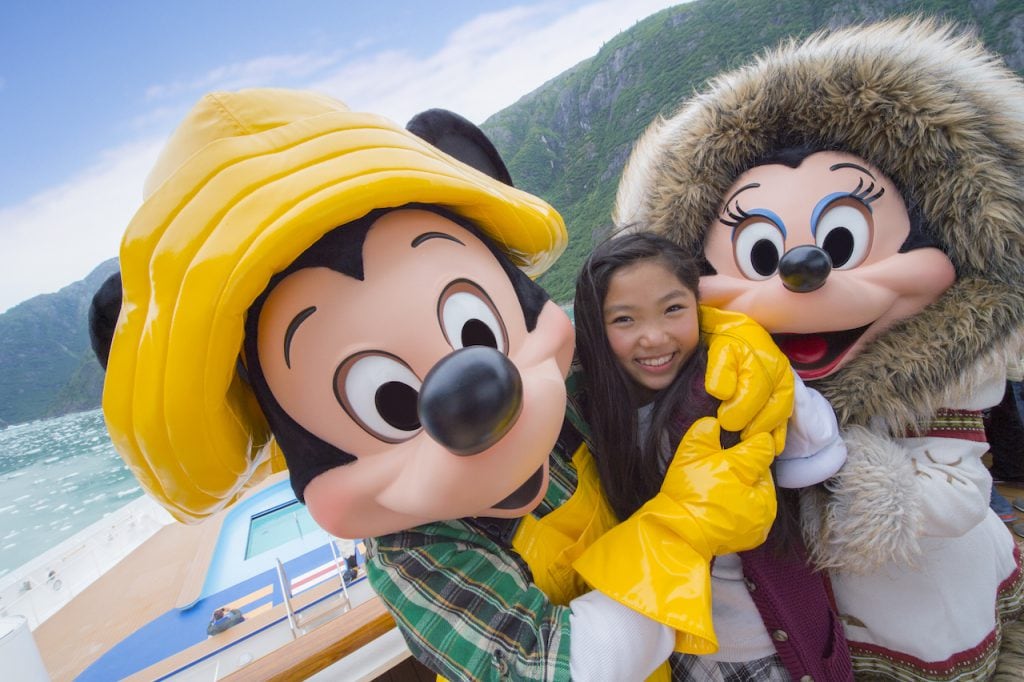 Guest with Mickey and Minnie on Disney Cruise in Alaska