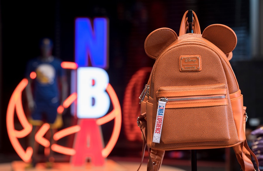Loungefly mini-backpack featuring Mickey Mouse Ears and a pebble-grain design that mimics a basketball in the NBA Store inside NBA Experience at Disney Springs