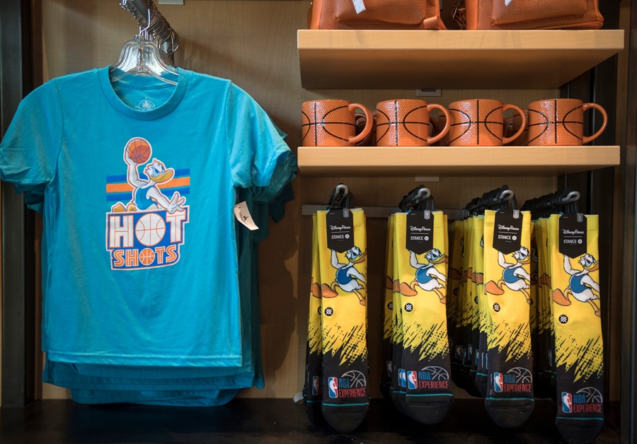 Donald Duck t-shirt and socks and basketball mugs in the NBA Store inside NBA Experience at Disney Springs