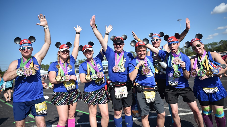 Runners display their runDisney medals