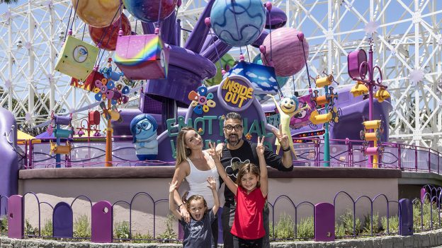 Actor Jaime Camil poses for a picture with his wife and children in front of Inside Out Emotional Whirlwind, Pixar Pier's newest attraction, at Disney California Adventure Park - Disneyland Resort