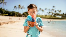 Child eating shaved ice at Aulani, a Disney Resort & Spa in Hawaii