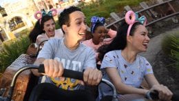 Guests ride Seven Dwarfs Mine Train at Magic Kingdom Park