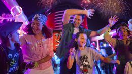 Family dancing at a deck party on Disney Cruise Line ship