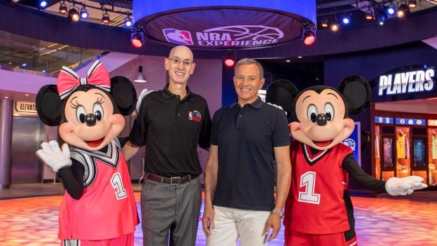 Disney Chairman and CEO Bob Iger and NBA Commissioner Adam Silver celebrate the grand opening of NBA Experience at Disney Springs with Mickey Mouse and Minnie Mouse.