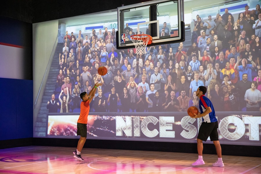 Shooting basketballs at the NBA Experience at Disney Springs