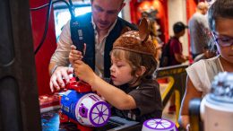 Child builds a droid at Droid Depot in Star Wars: Galaxy's Edge at Disney's Hollywood Studios