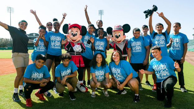 Orlando After-School All-Stars pose with Mickey Mouse and Minnie Mouse at ESPN Wide World of Sports Complex