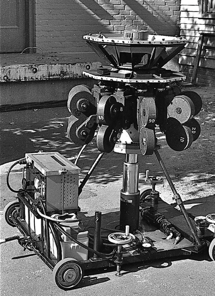 The updated 35mm Circle-Vision 360° camera mounted on a dolly with a hydraulic lift for moving shots. © Disney