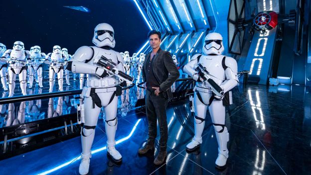 John Stamos and Stormtroppers in Star Wars: Rise of the Resistance