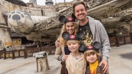 Family poses for photo in Star Wars: Galaxy's Edge