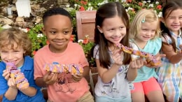Disney Kids eating treats at Magic Kingdom Park