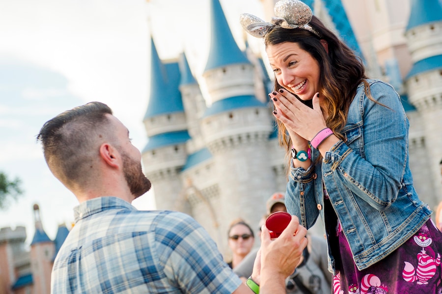 Couple getting engaged at Magic Kingdom Park