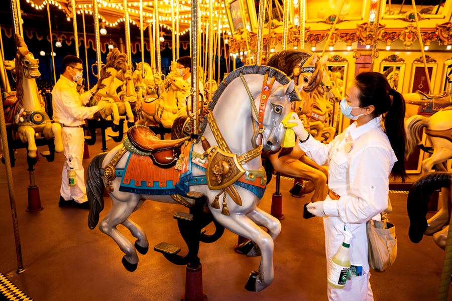 Cast members clean Cinderella Carousel at Hong Kong Disneyland