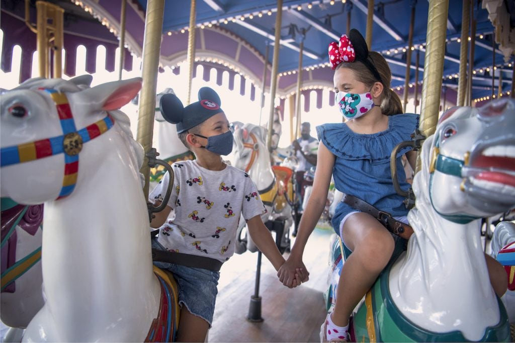 Young guests on Prince Charming Regal Carrousel at Magic Kingdom Park