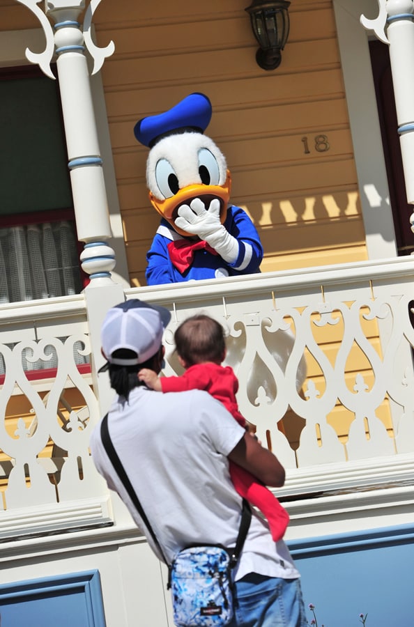 Guests wave to Donald Duck at Disneyland Paris