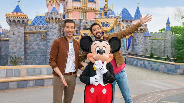 Drew and Jonathan Scott pose with Mickey Mouse at Disneyland Park