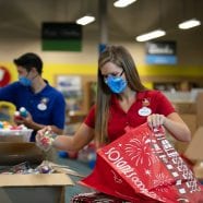 Walt Disney World Ambassadors Marilyn West and Stephen Lim packing supplies at A Gift For Teaching