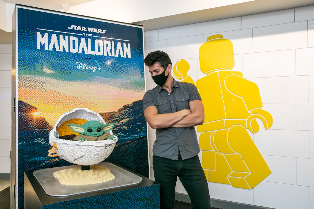 one-of-a-kind LEGO mural inspired by “The Mandalorian” in the LEGO Store lobby at Disney Springs