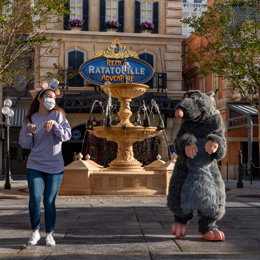 ‘Ratatouille’ Fan Emily Jacobsen with Remy in front of Remy’s Ratatouille Adventure at EPCOT