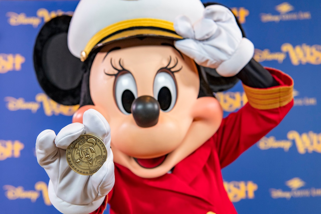 Minted coin featuring Captain Minnie Mouse that is placed under the keel of the new Disney Wish