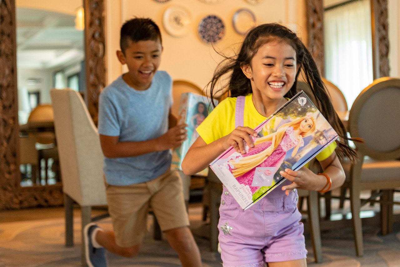 Girl and boy excited about their new shopDisney gifts