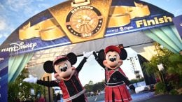 Mickey Mouse and Minnie Mouse at the end of a runDisney race