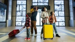 Family in the lobby of Disney’s Hotel New York –The Art of Marvel