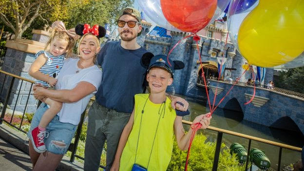Hilary Duff, her husband, singer-songwriter Matthew Koma, their daughter Banks, 2, and Duff's son Luca, 9, posed for a photo on the steps of Sleeping Beauty Castle at Disneyland park