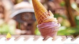 “Tamatoa-inspired” Dipped Cone with DOLE Whip raspberry swirled with DOLE Whip orange in a white chocolate-dipped waffle cone coated with “shiny” gold sugar