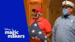 Rob Vickers of Gulf Breeze, Florida, with the flag at Magic Kingdom Park