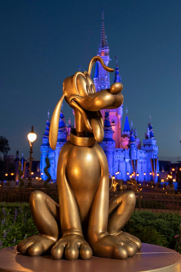 Pluto at Magic Kingdom Park is one of the “Disney Fab 50” golden character sculptures