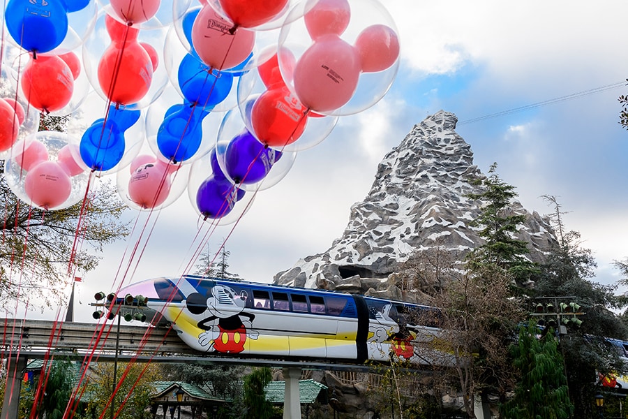 Disneyland monorail passes by Matterhorn Mountain attraction