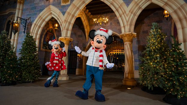 Mickey and Minnie in new holiday outfits