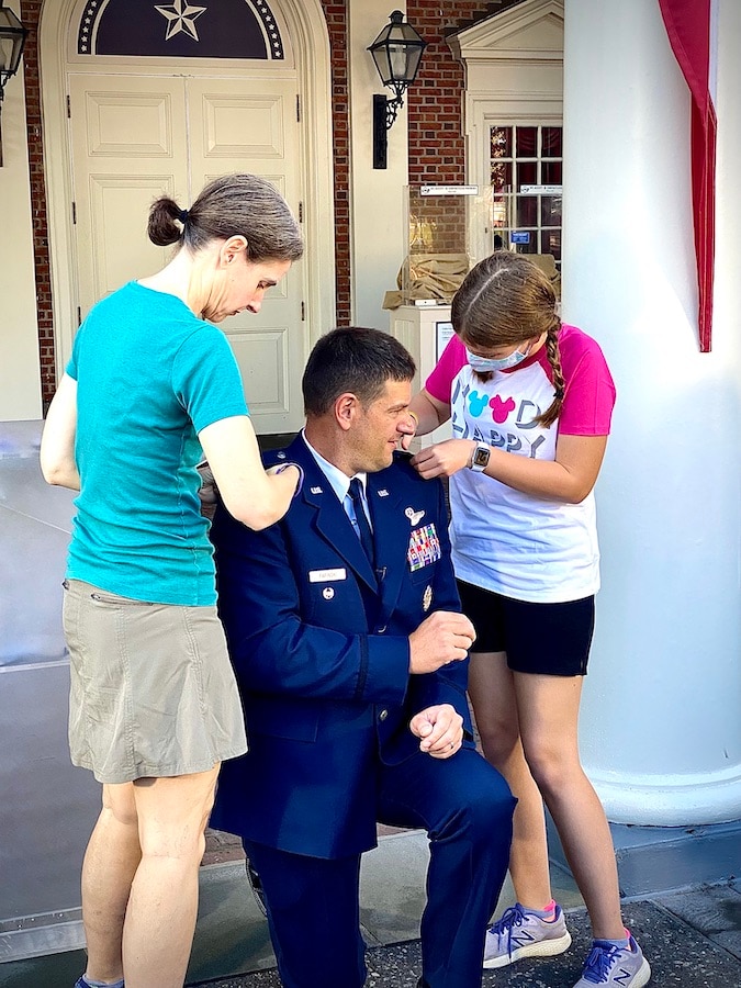 2021 promotion ceremony of US Air Force Colonel Alex Fafinski with at EPCOT cast members Javier Rossy, Mallory Ledet and Hannah Blatt