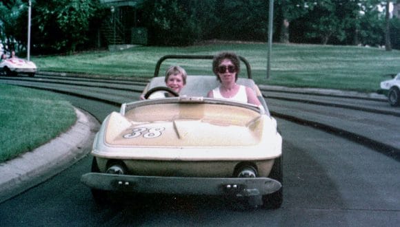 Steven Miller with his mother on the Tomorrowland Speedway in Magic Kingdom Park