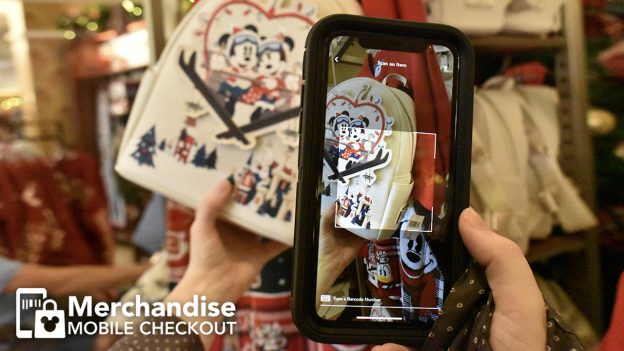 Graphic of guest using mobile checkout at Disney merchandise location