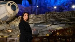Disney Legend and ‘The Book of Boba Fett’ Star Ming-Na Wen stand in front of the millennium falcon in Galaxy's Edge