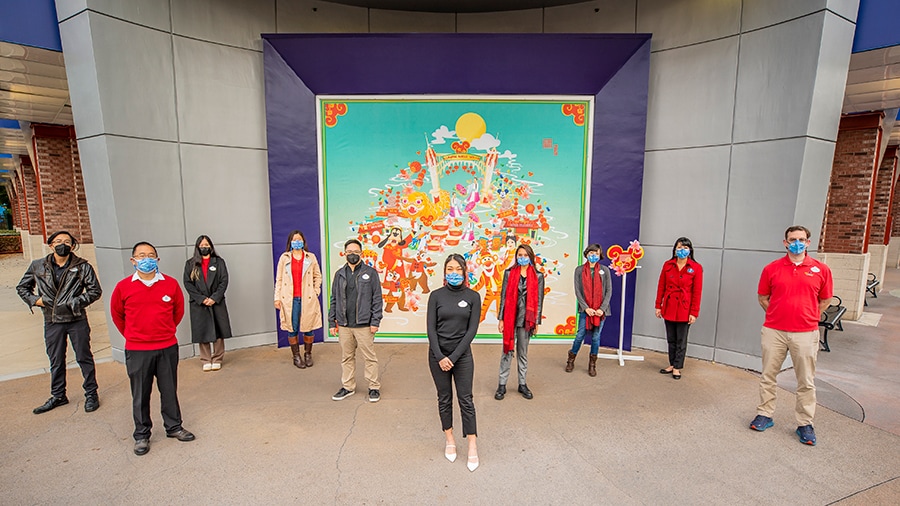 COMPASS Team in front of mural at Downtown Disney